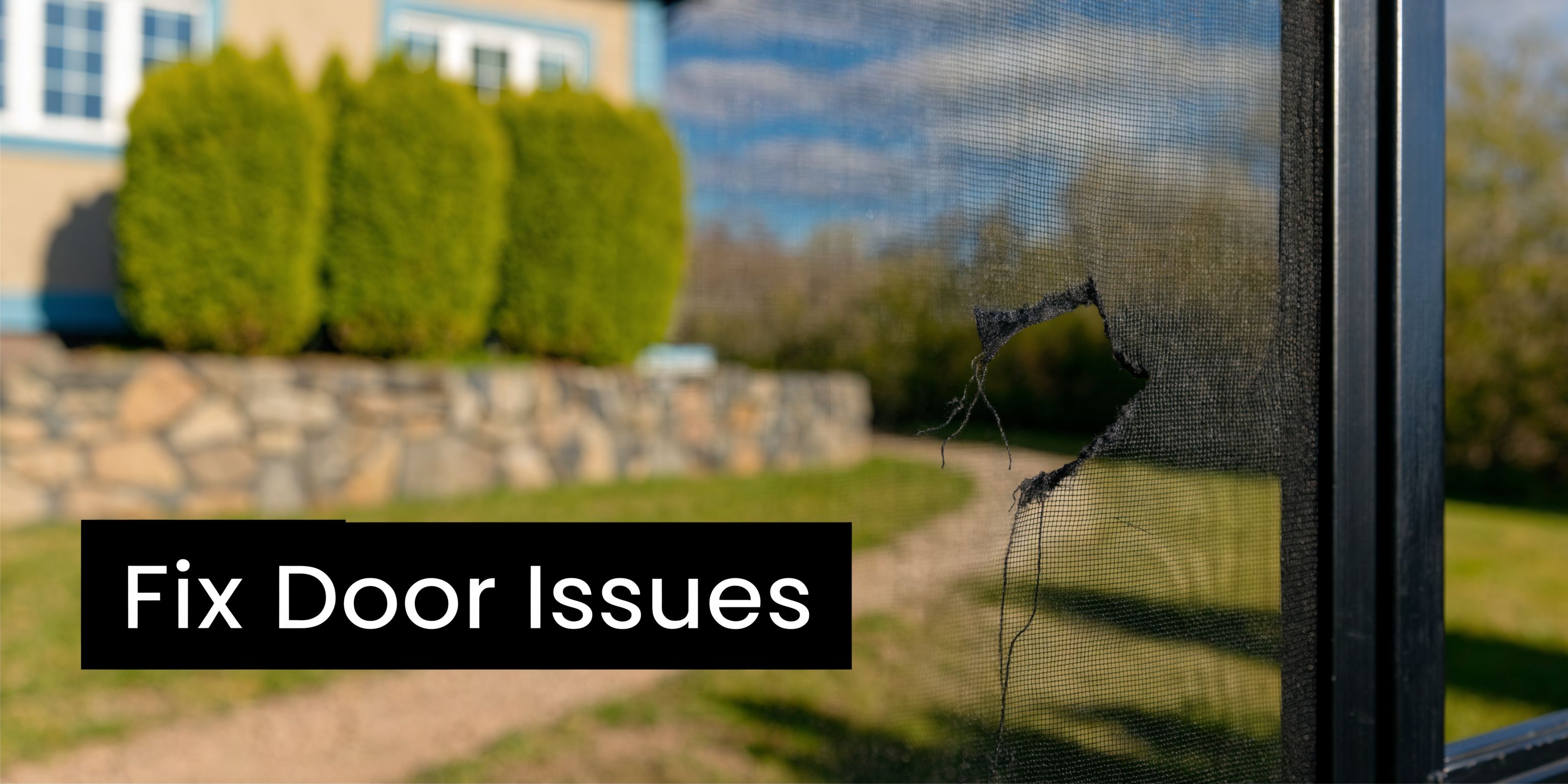 A close-up view of a torn screen mesh on a sliding door with a house in background.