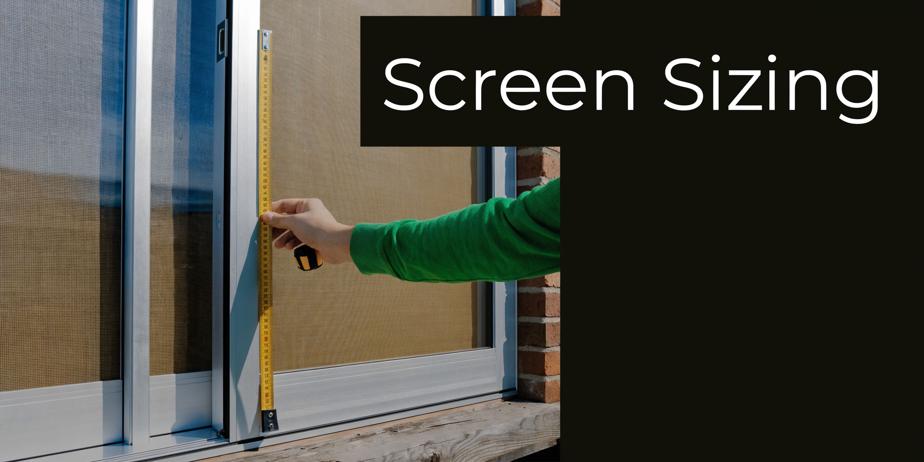 A person holding a yellow tape measure against a sliding window frame to determine screen size.